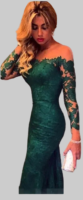 Woman wearing a green lace dress with long sleeves against a plain background