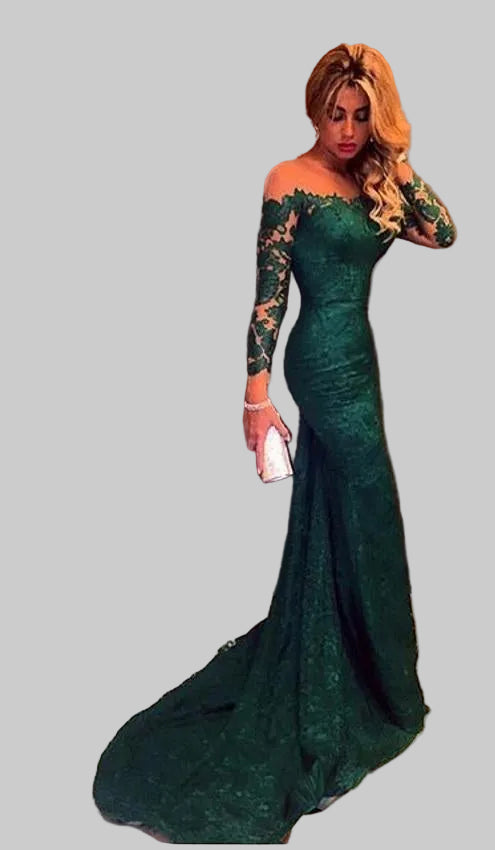 Woman wearing a green off-shoulder evening gown with long sleeves in an indoor setting.