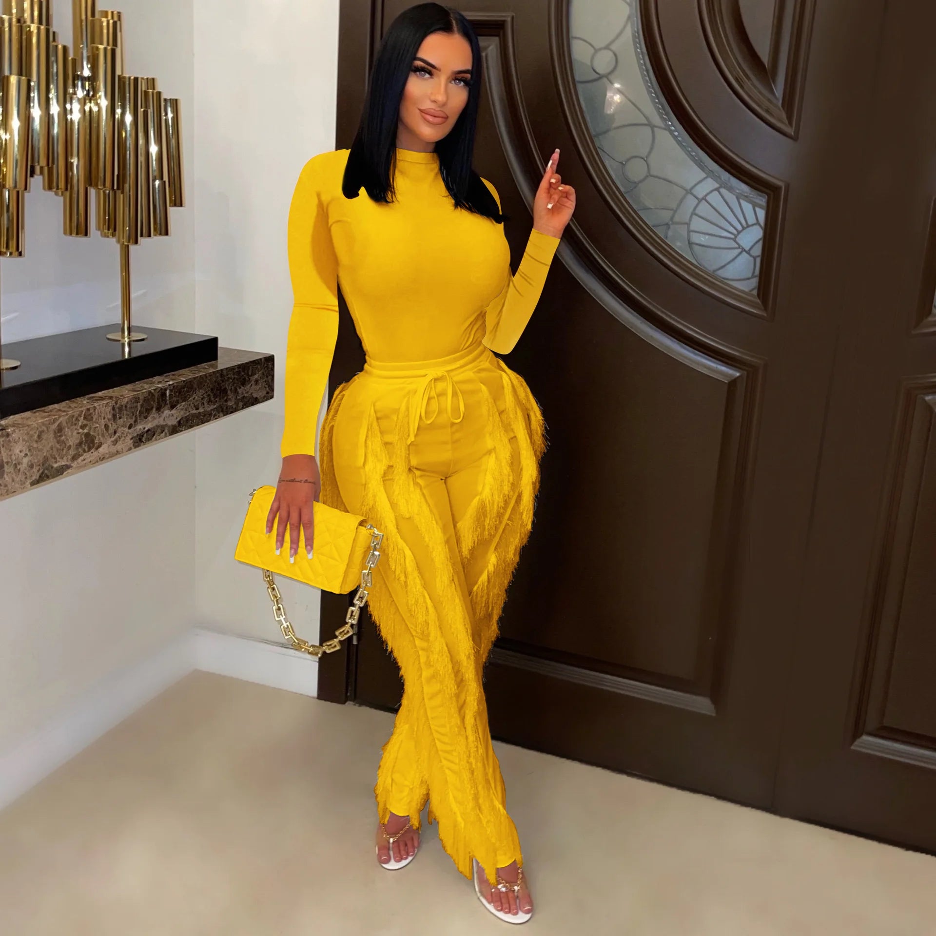 yellow 2 piece long sleeve body suit and fitted fringe pants